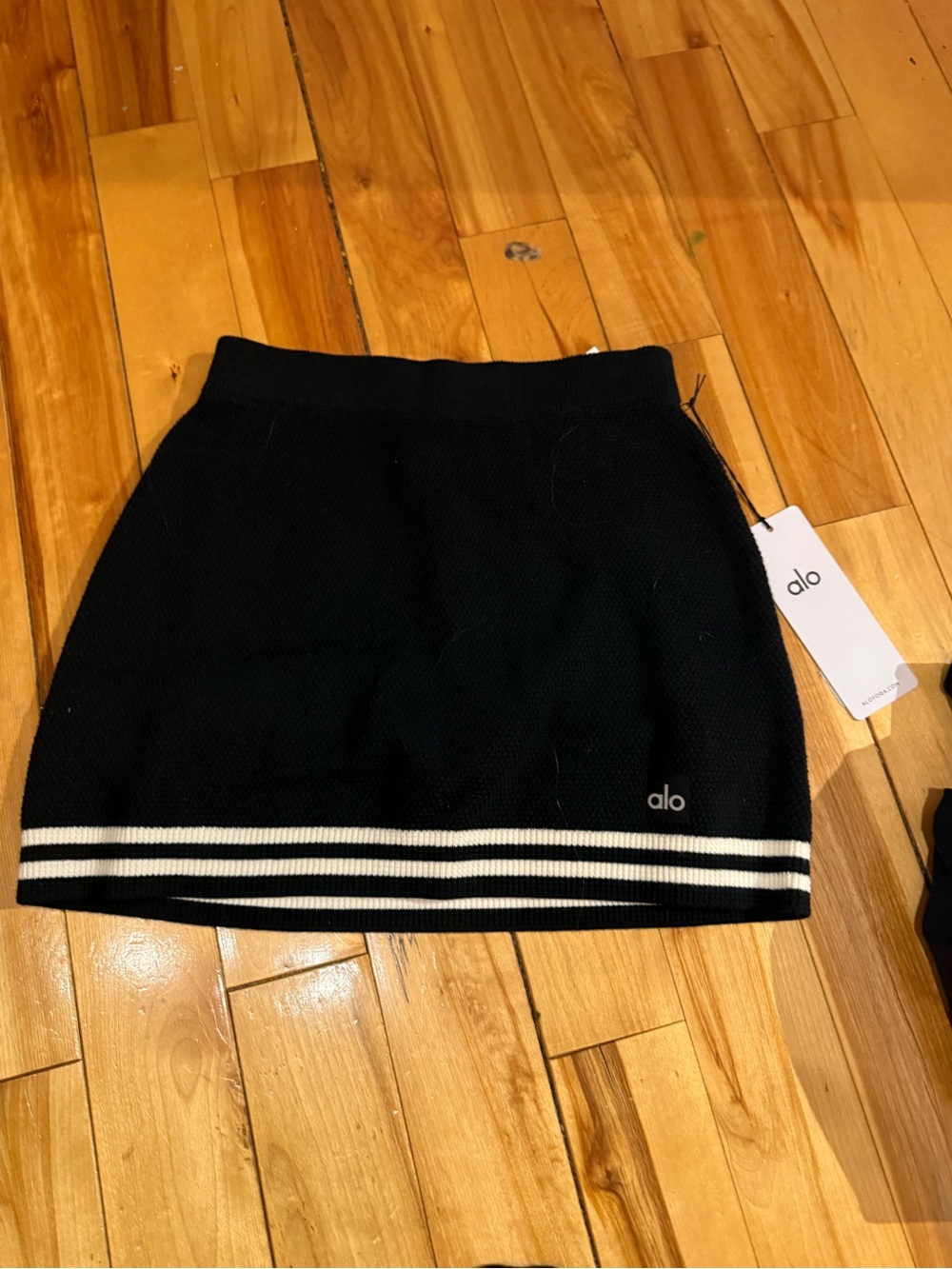 ALO Yoga Black Mini Skirt with White Stripe Hem